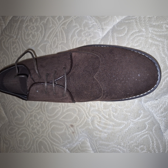 A pair of Franco Vanucci brown suede men\'s loafers in a size 10.5. EUC.